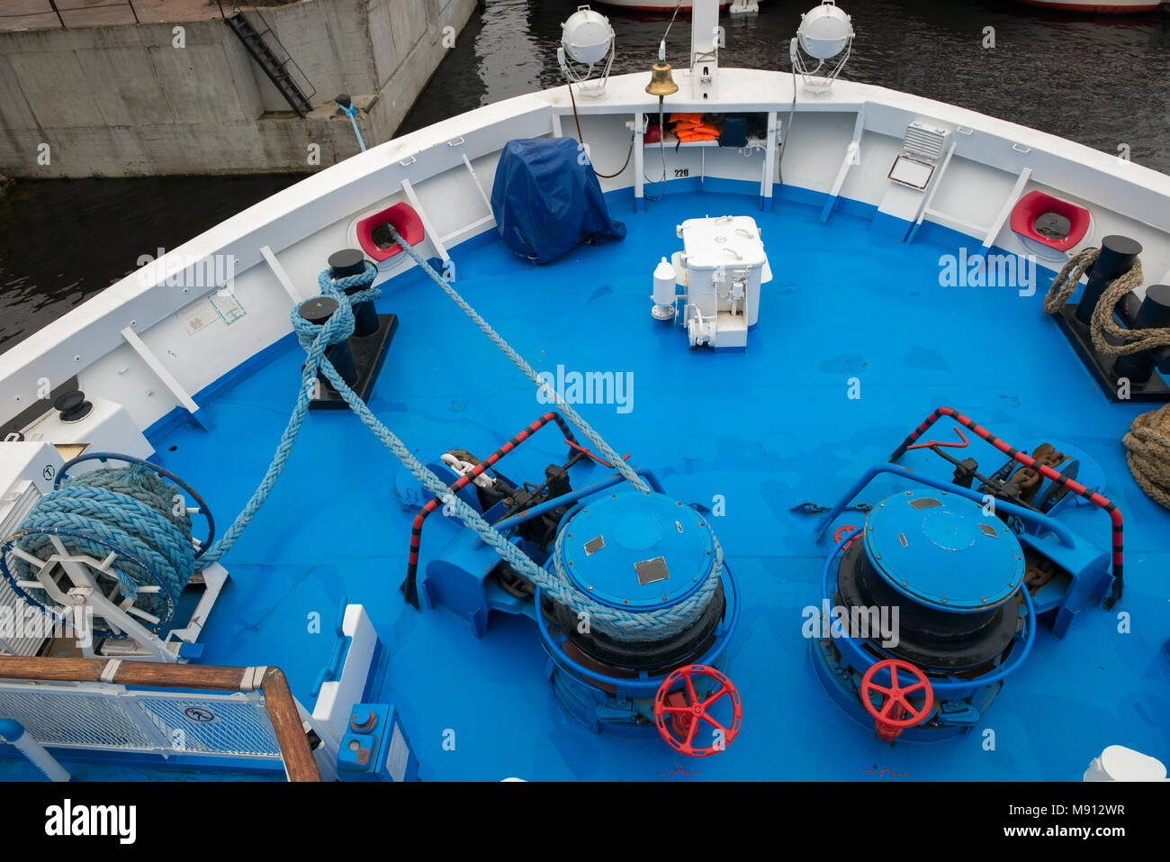 Mooring station on a forward, Anchor windlass mechanism of with rope in  ship Stock Photo - Alamy