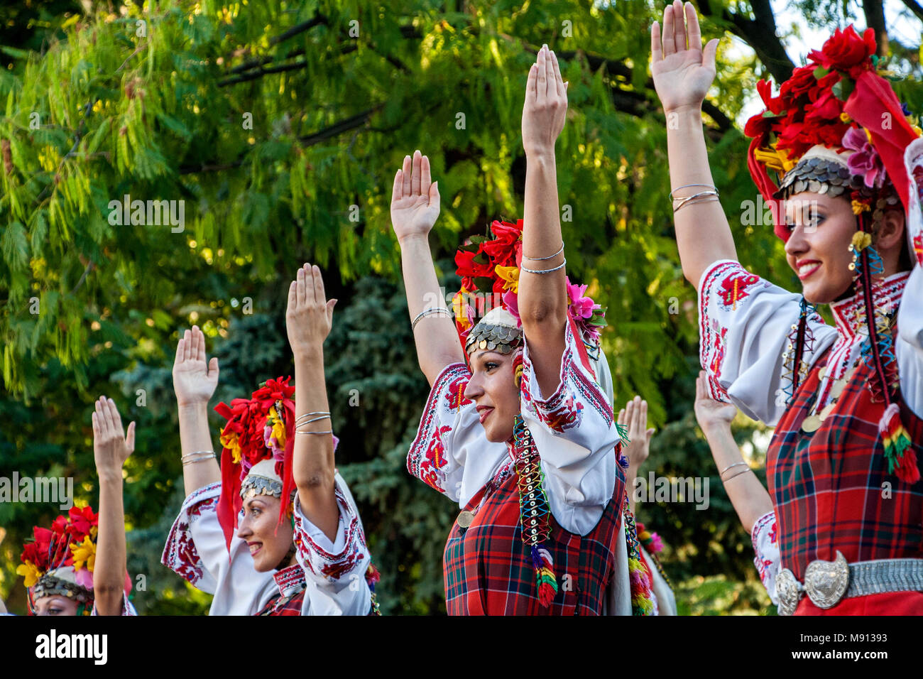 Plovdiv, Bulgaria 3rd August 2013: Beautiful Bulgarian women dancers performing on stage of the XIX International Folklore Festival. Stock Photo