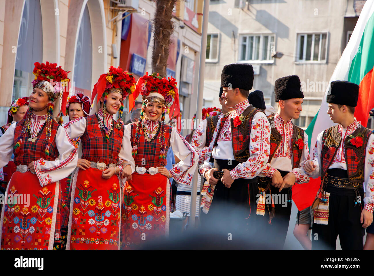 Plovdiv, Bulgaria 3 August 2013: Dancers form Ensemble Trakia with colorful Bulgarian costumes are walking on procession to promote their performance Stock Photo
