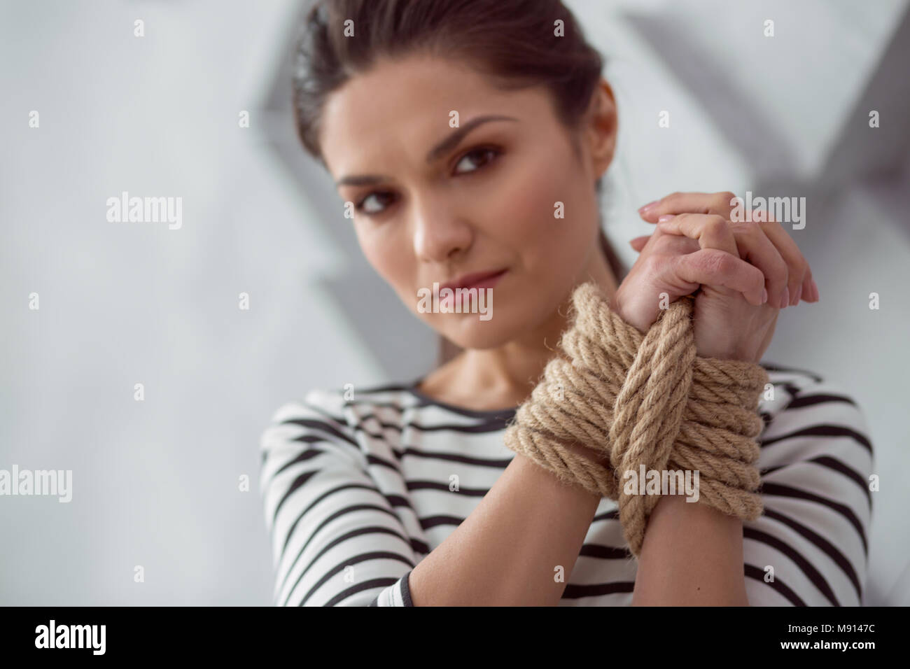 Tied up female hands Stock Photo - Alamy