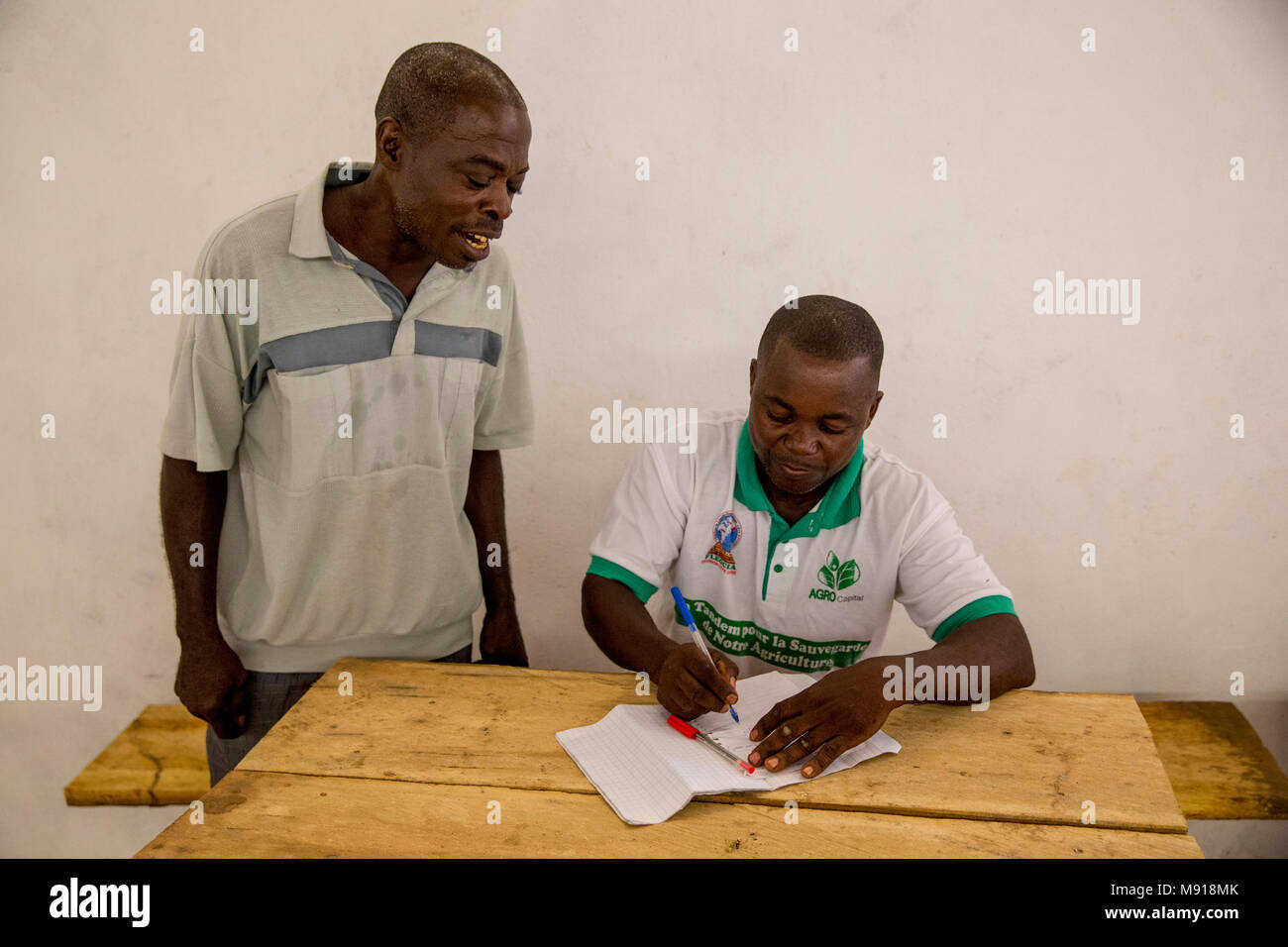 Ivory Coast. Cocoa farmers in their warehouse. Stock Photo
