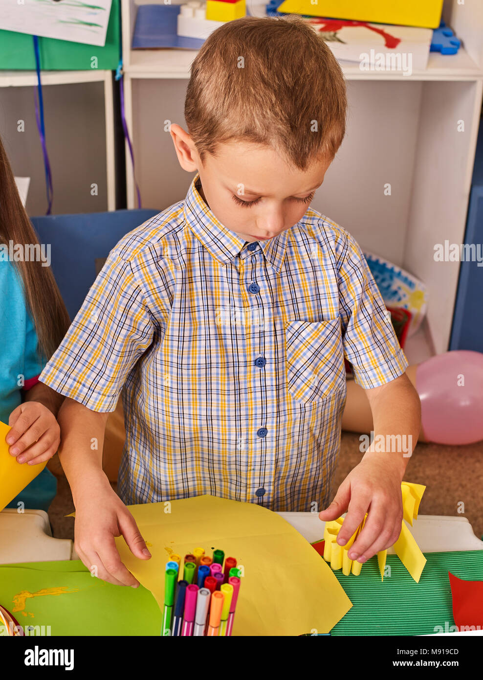 Small student child painting in art school class Stock Photo - Alamy