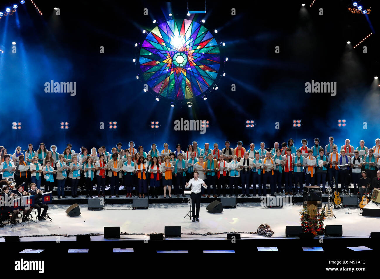 Protestant celebration at the Zenith of Strasbourg.  Conductor directing women choir on stage.  Strasbourg. France. Stock Photo