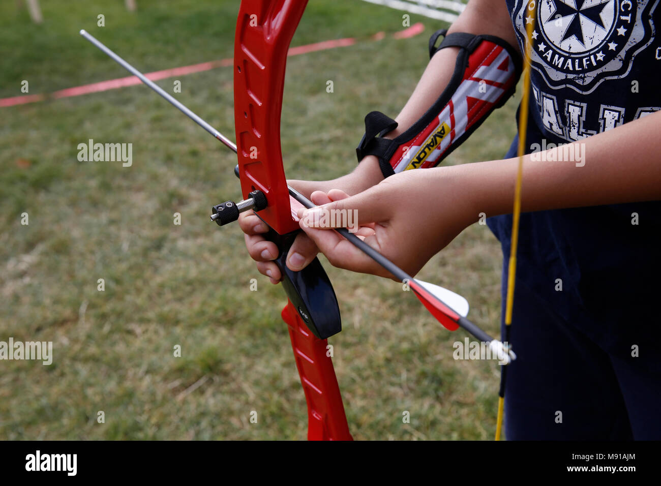 11-year-old boy practising archery in Paris, France. Stock Photo