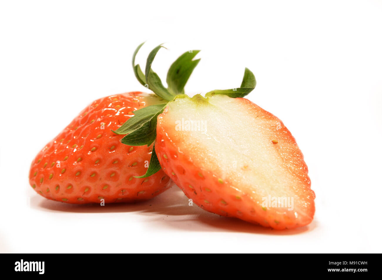 Strawberry fruits isolated on a white background Stock Photo - Alamy