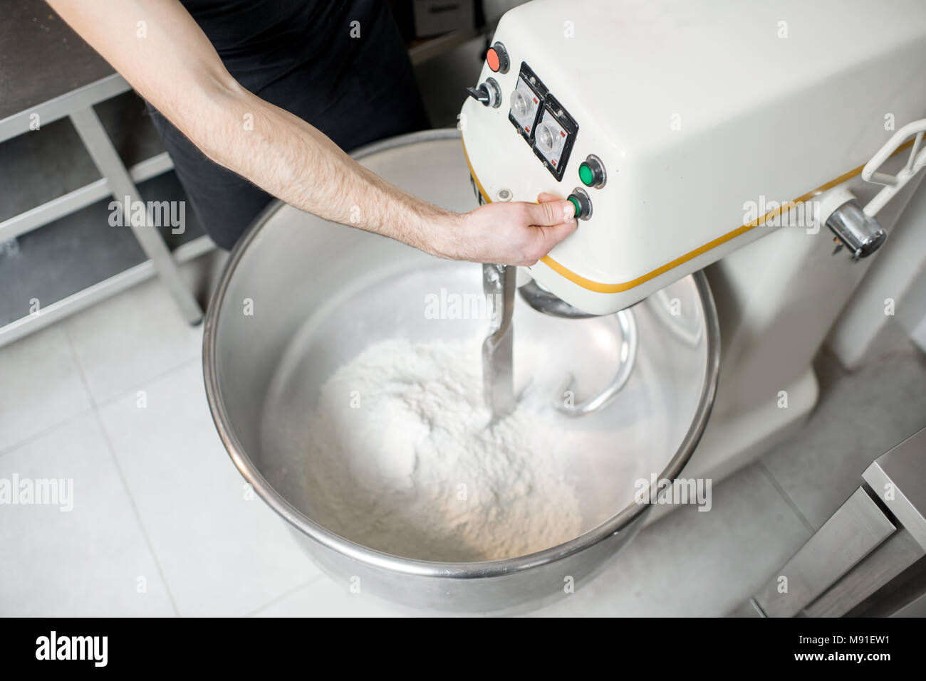 Bread Mixer In Bakery, mixing dough for baguettes in a bakery machine for  mixing dough Stock Photo - Alamy