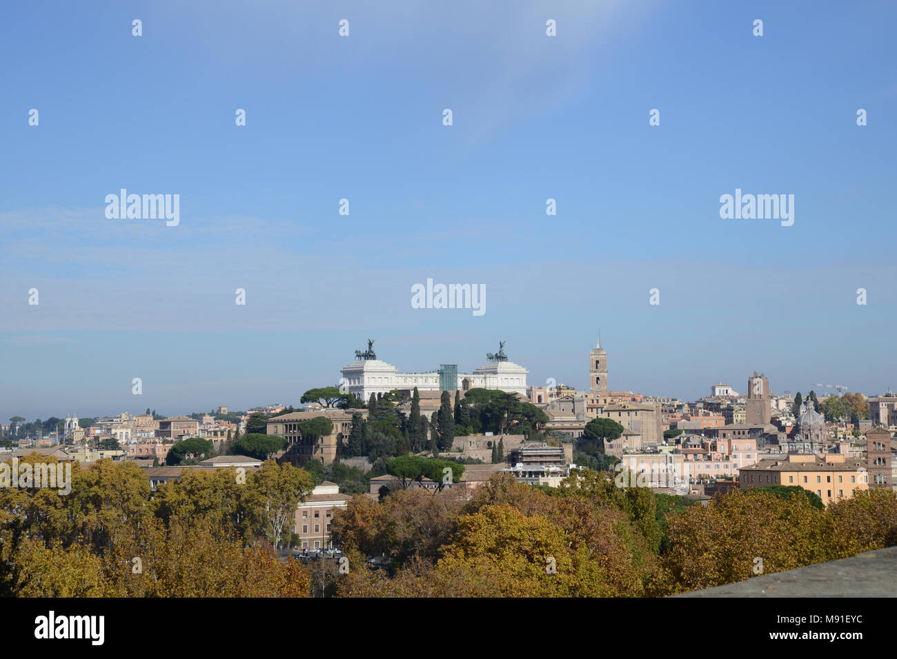 Altare della Patria seen high on the horizon in the distance from the Aventine Hill in Rome, Italy Stock Photo