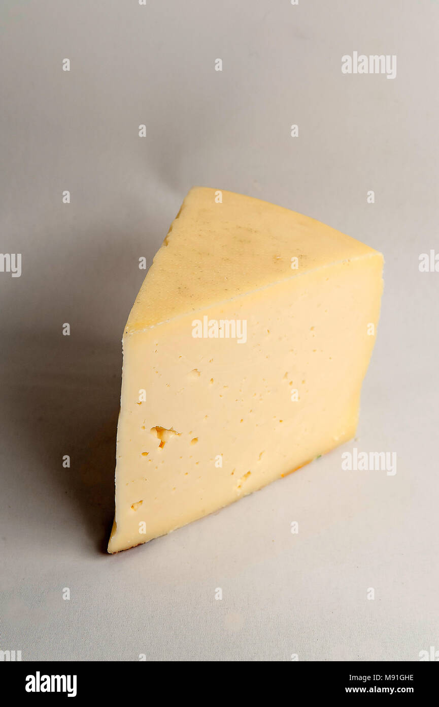 Italian semi hard cheese Asiago Stock Photo Alamy
