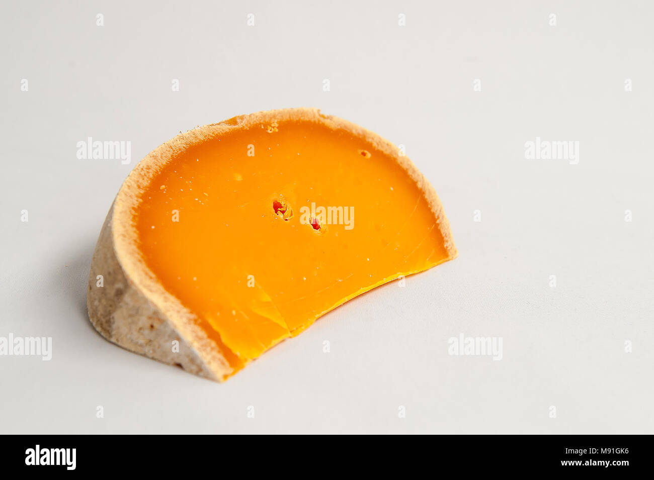 Studio photography of French cheese Mimolette Stock Photo