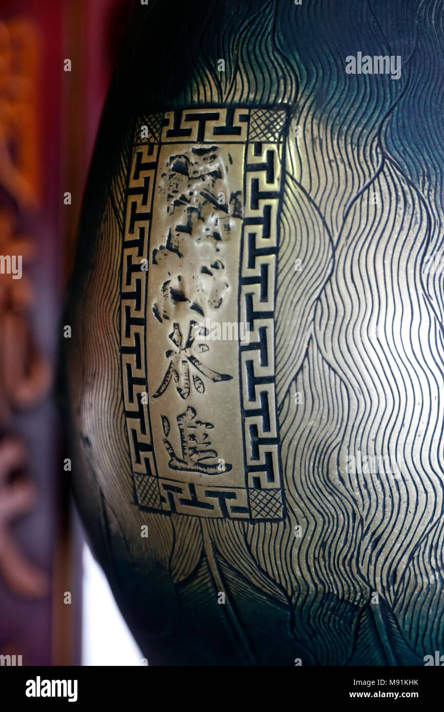 The Temple of Literature is Confucian temple which was formerly a center of learning in Hanoi.   Altar of Confucius.  Bronze phoenix. Close-up.  Hanoi Stock Photo