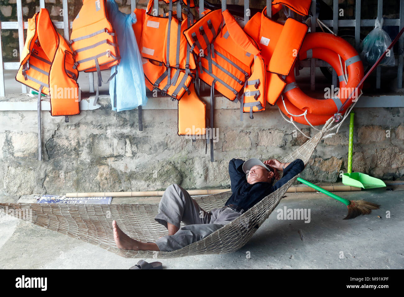 Man sleeping in hammock. Phu Quoc. Vietnam. Stock Photo