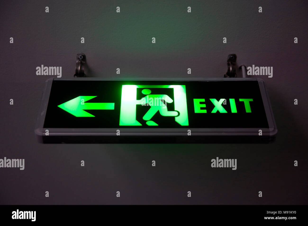 Illuminated green exit sign. Phu Quoc. Vietnam. Stock Photo