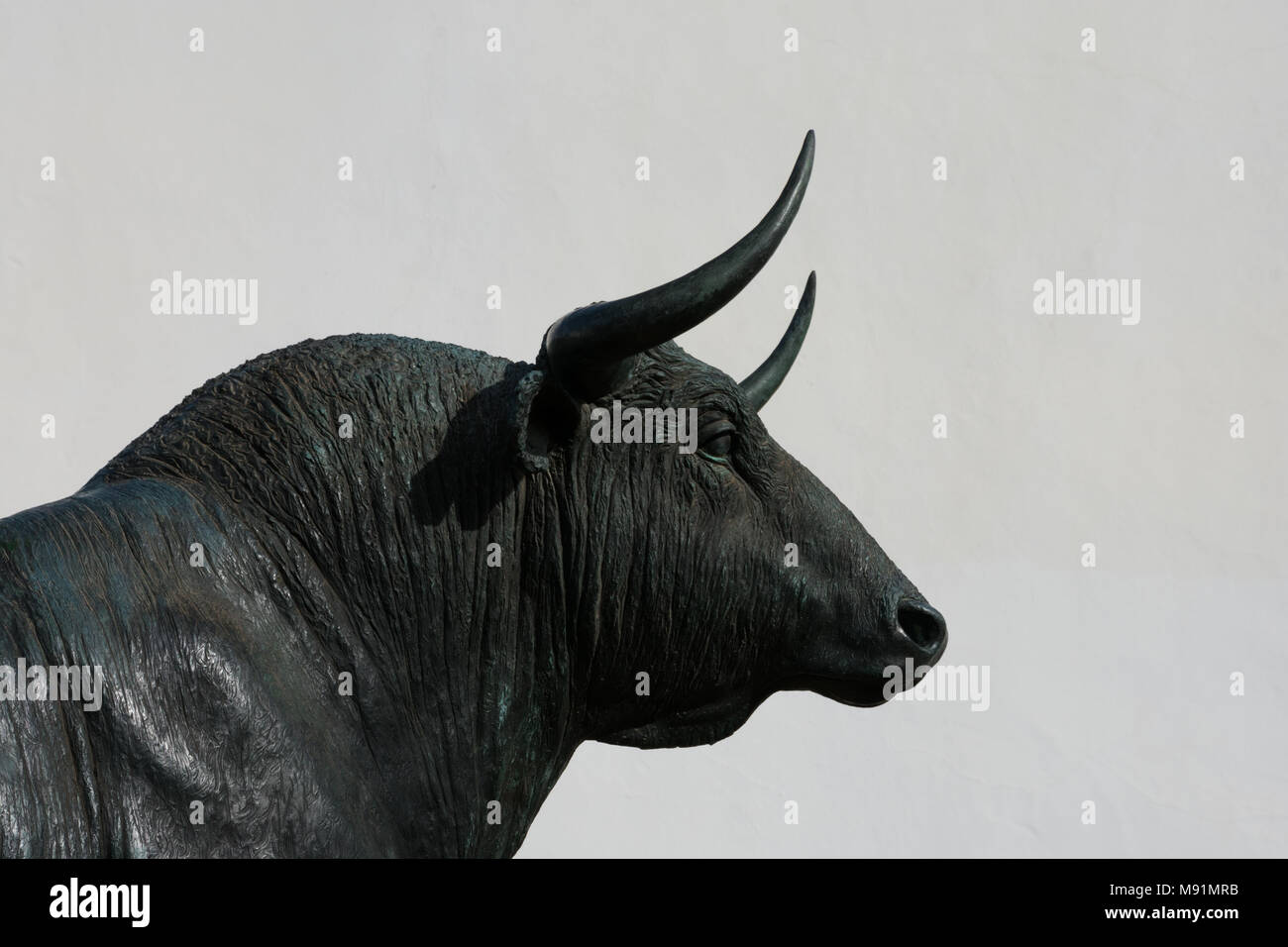 Ronda, Spain. January 19, 2018.  Bull statue in front of the bullring arena (Plaza de Toros) Stock Photo