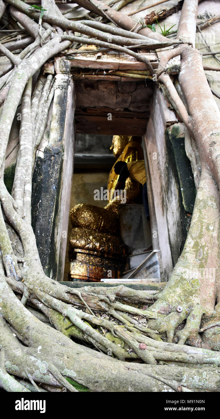 Old buddha statue in ubosot of Wat Bang Kung for people travel and resepct praying at Bang Kung Sub-district in Bang Khontee District of Samut Songkhr Stock Photo