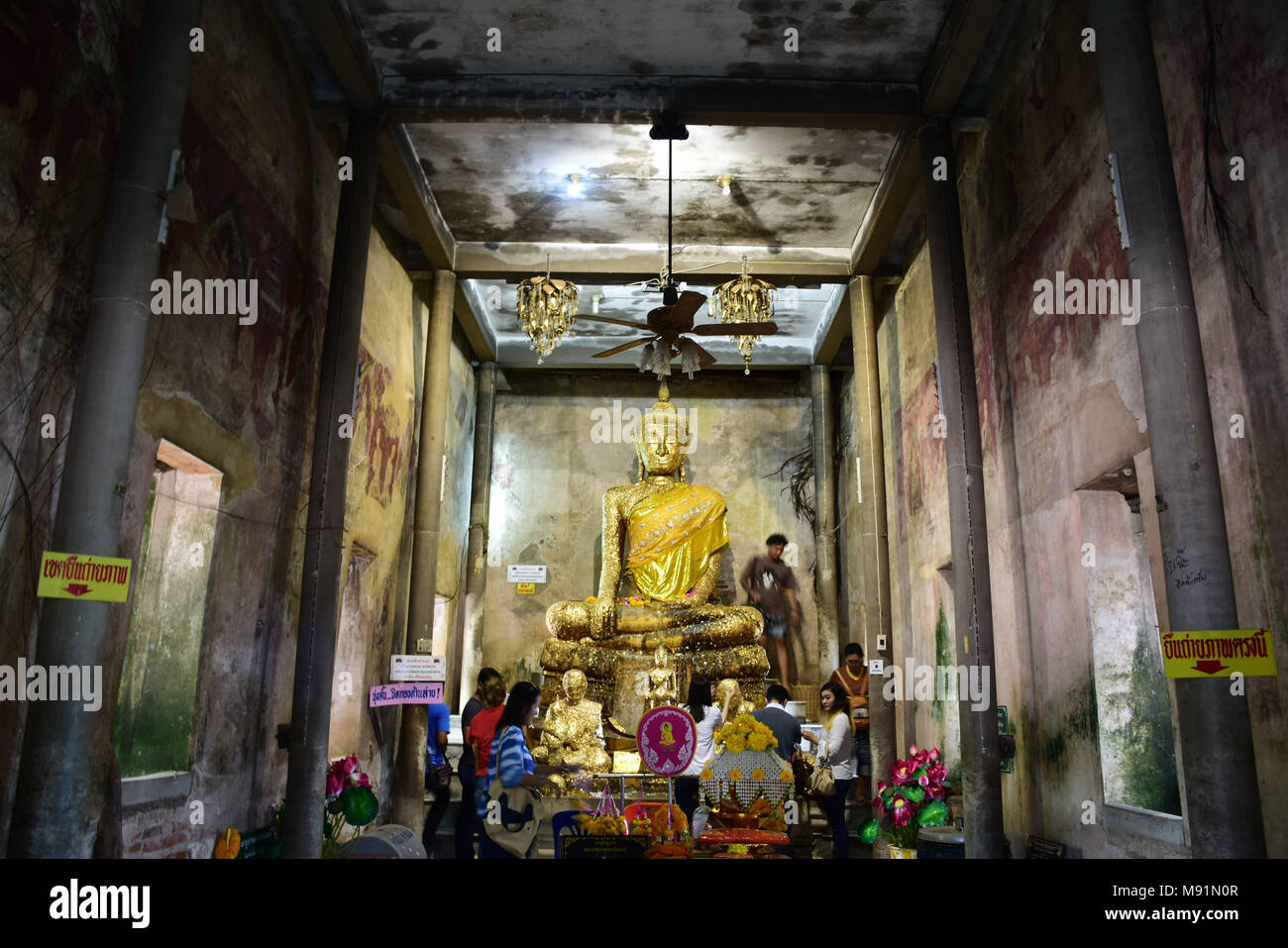 Thai people visit travel and respect praying with old buddha statue in ubosot of Wat Bang Kung at Bang Kung Sub-district in Bang Khontee District on S Stock Photo