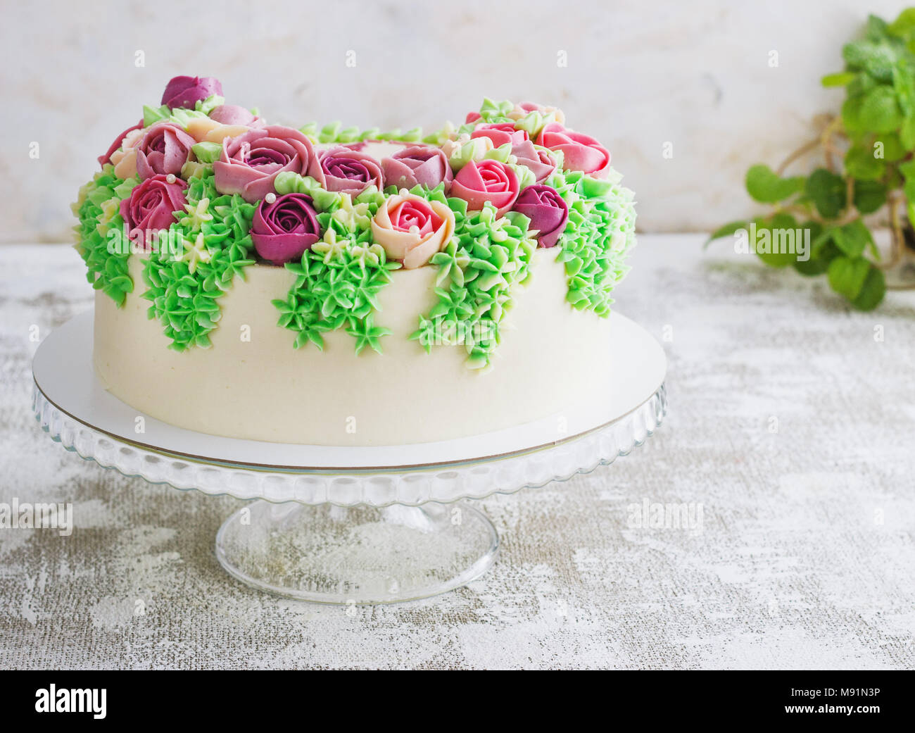 Birthday cake with flowers rose on white background. Malaysian flowers