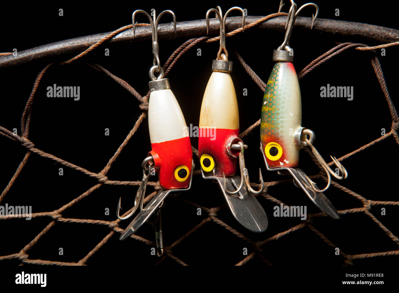 An example of an old South Bend fishing lure, or plug, designed to catch  predatory fish displayed on a dark slate background. From a collection of  vin Stock Photo - Alamy