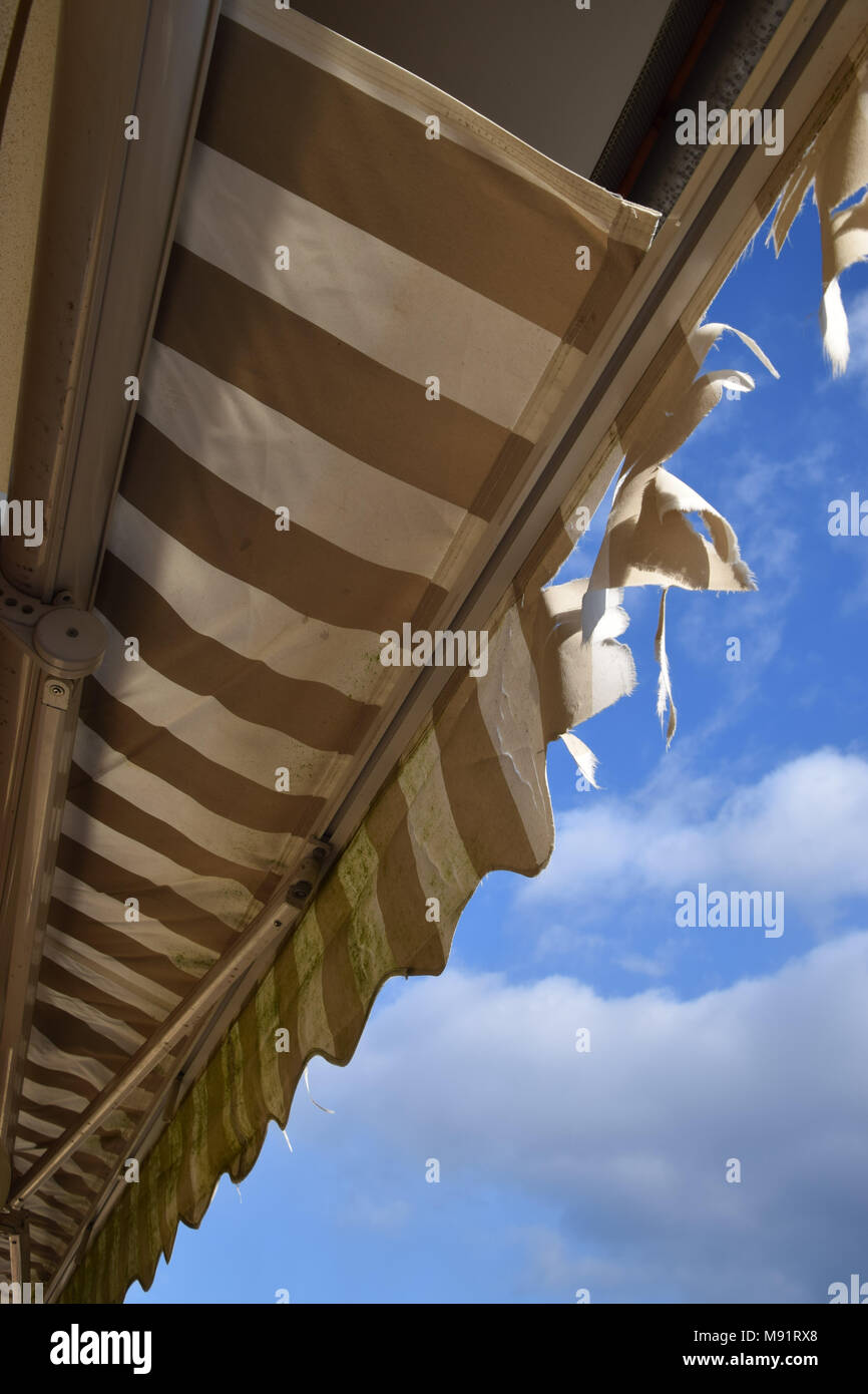 old awning with torn Cotton fabric Stock Photo