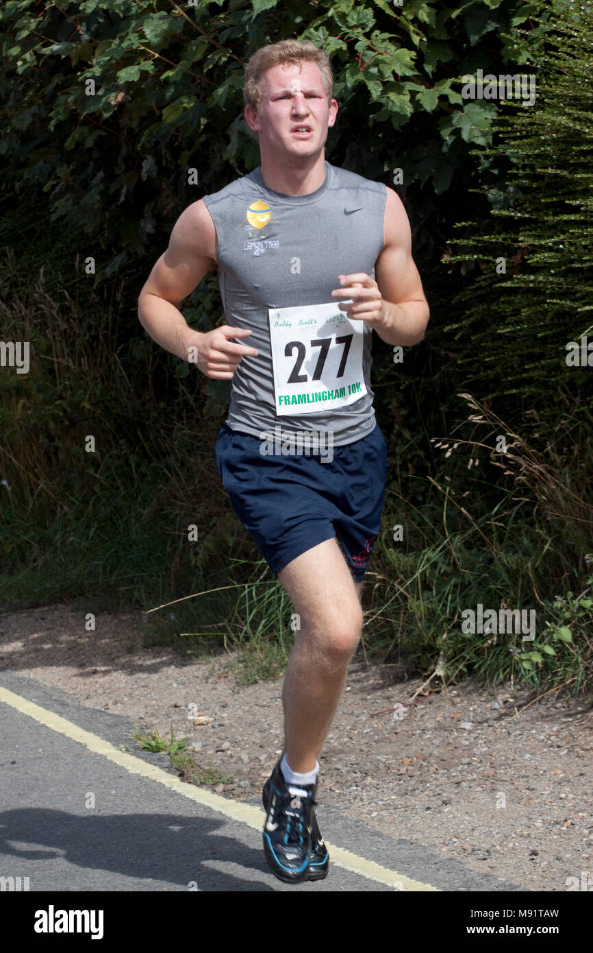 Runners on a country road competing in a 10km race Stock Photo - Alamy