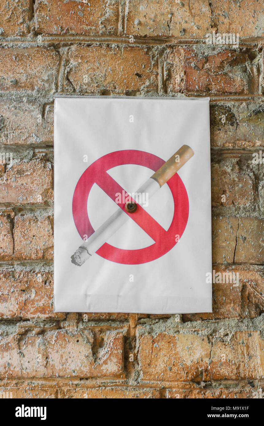words for smoking a cigarette No Smoking Sign, Red and White sign with words No Smoking and cigarette  symbol on a brick wall Stock Photo