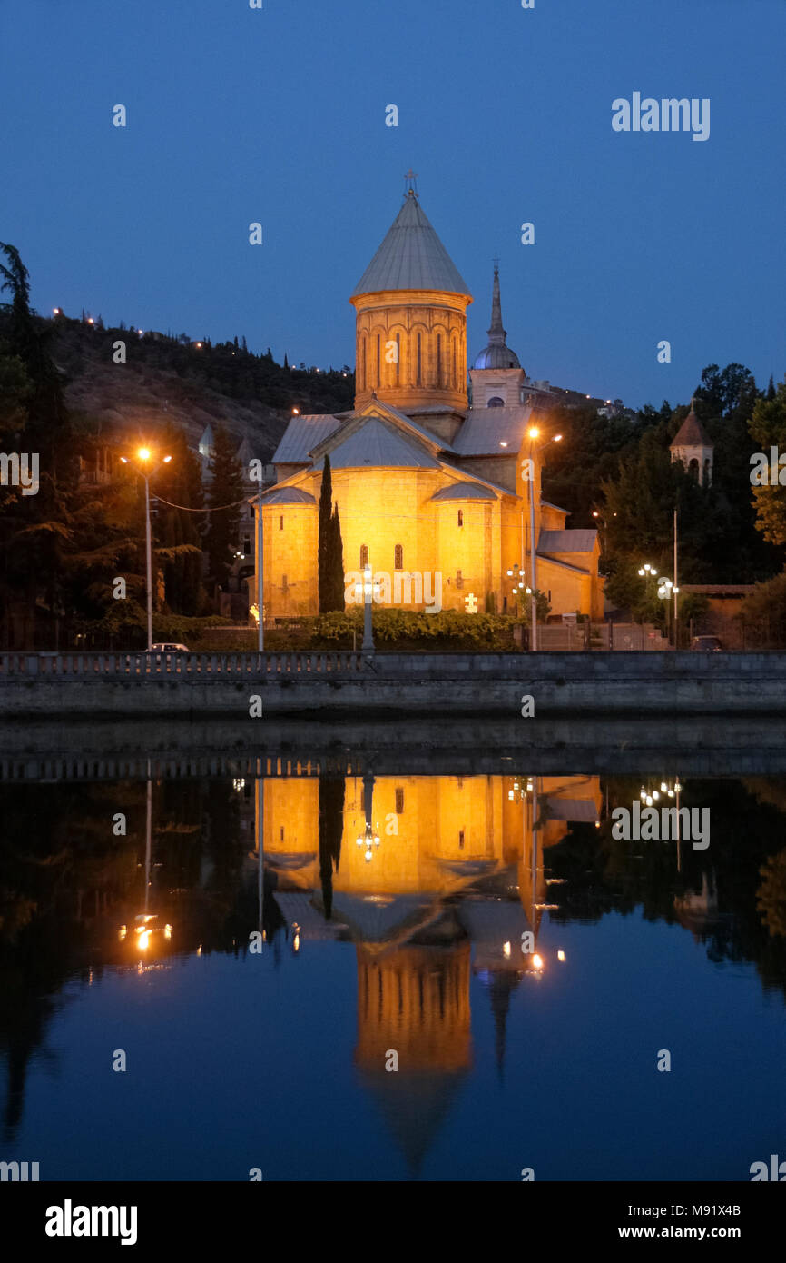 Sioni Cathedral (Georgian Orthodox) lighted at dawn and reflected in Mtkvari River, Tbilisi, Georgia Stock Photo