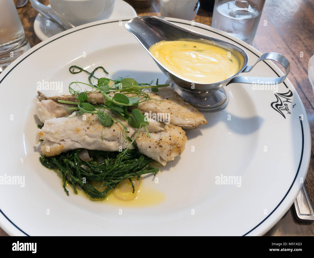 Roast Hake with  béarnaise, sauce and samphire served at the famous Magpie Café in historic  Whitby North Yorkshire England UK Stock Photo