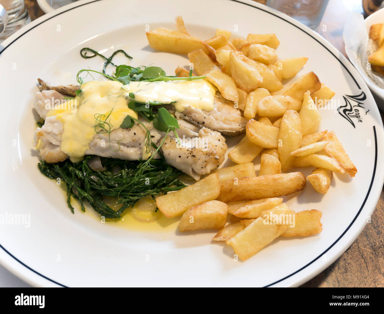 Roast Hake with  béarnaise, sauce samphire and chips served at the famous Magpie Café in historic  Whitby North Yorkshire England UK Stock Photo