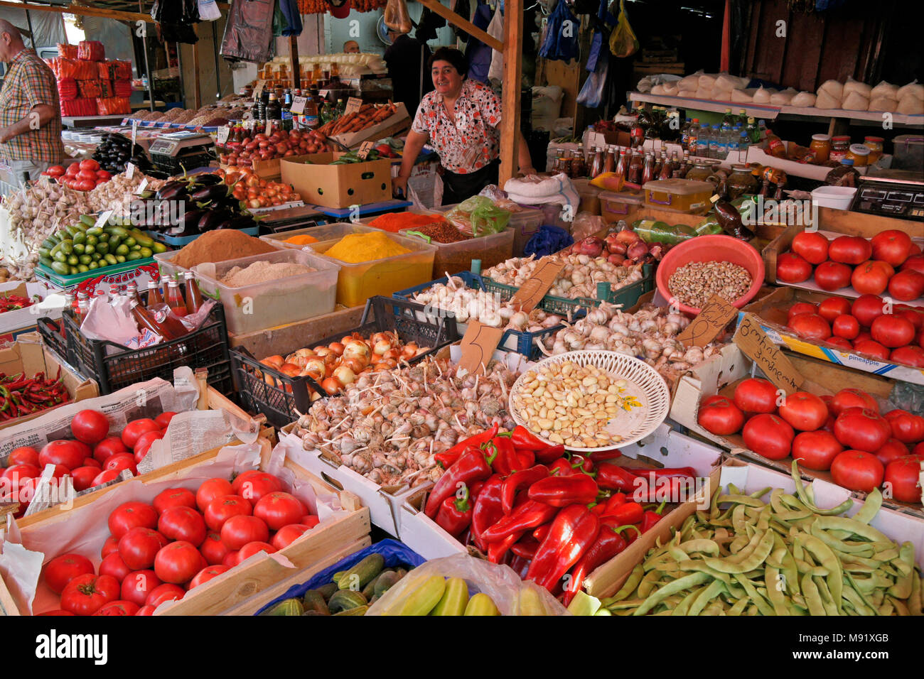 Vendors selling a wide variety of fresh produce, spices, and other