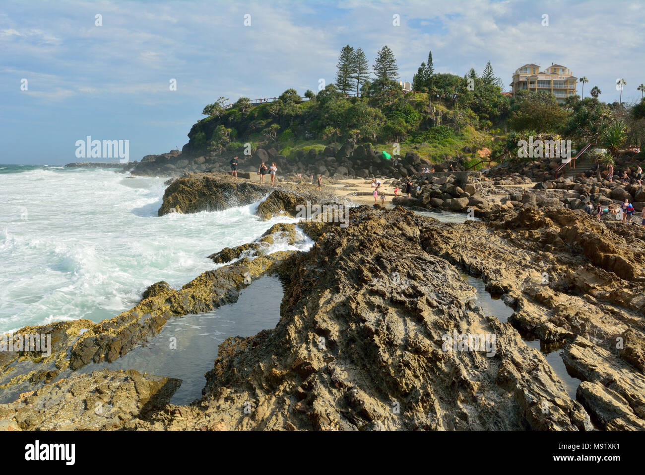 Tweed Heads, Gold Coast, Queensland, Australia - January 13, 2018. Rocky coastline at Point Danger headland on the Gold Coast of Queensland, with peop Stock Photo