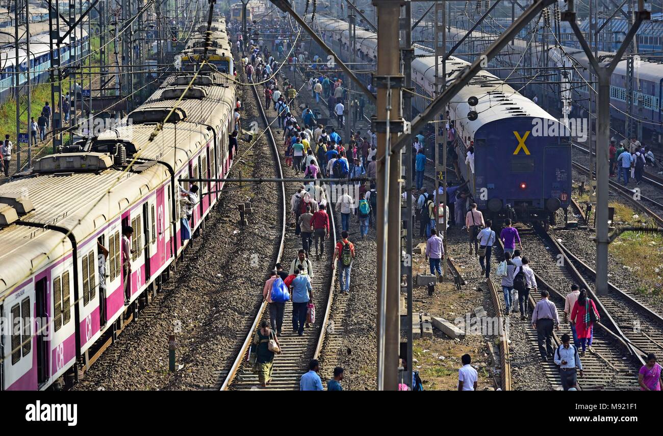 MUMBAI, INDIA - MARCH 20: Commuters walking on the track between 