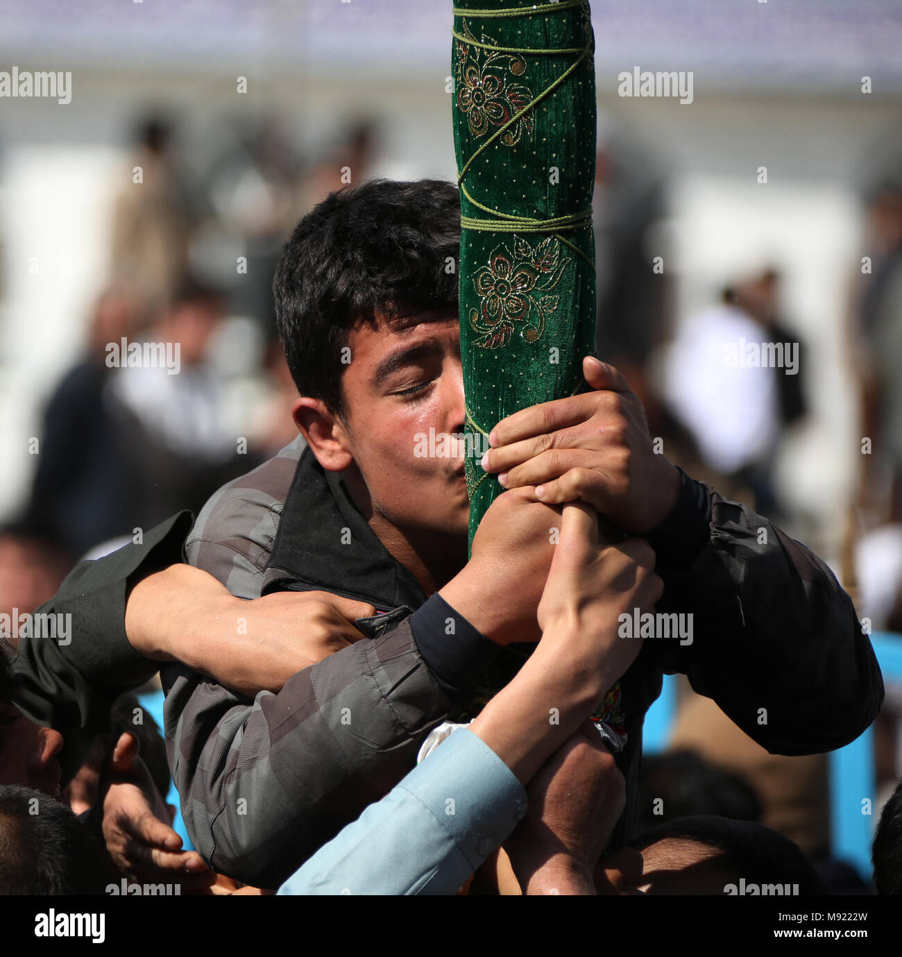 Kabul, Afghanistan. 21st Mar, 2018. An Afghan man kisses a holy stick