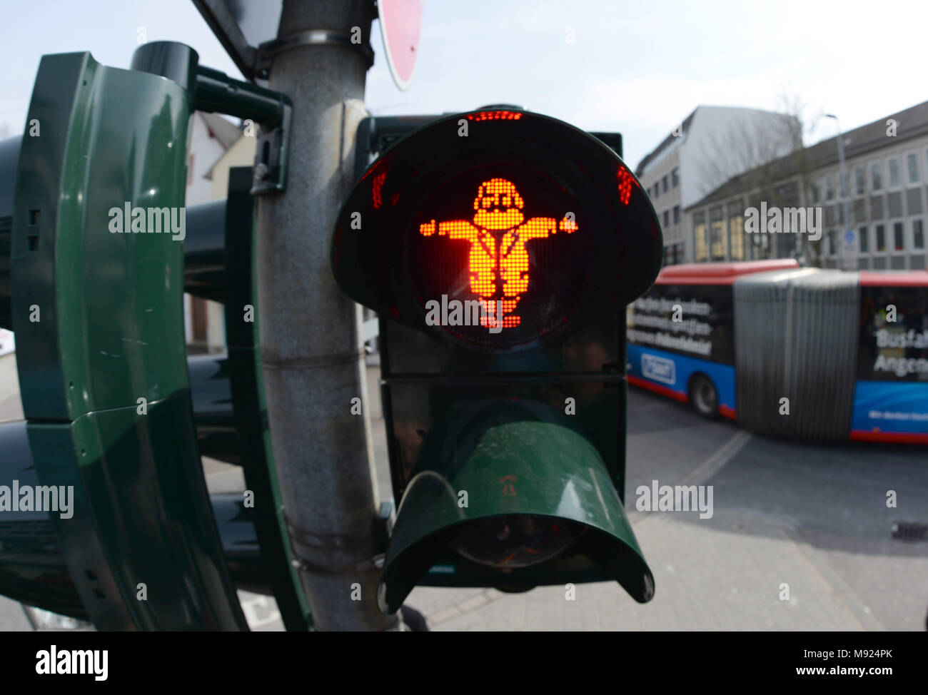 19 March 2018, Germany, Trier: A Karl Marx figure shines on the traffic light. LED technology and stencils were installed for the traffic light close to the soon to be erected Karl Marx statue. Photo: Harald Tittel/dpa Stock Photo