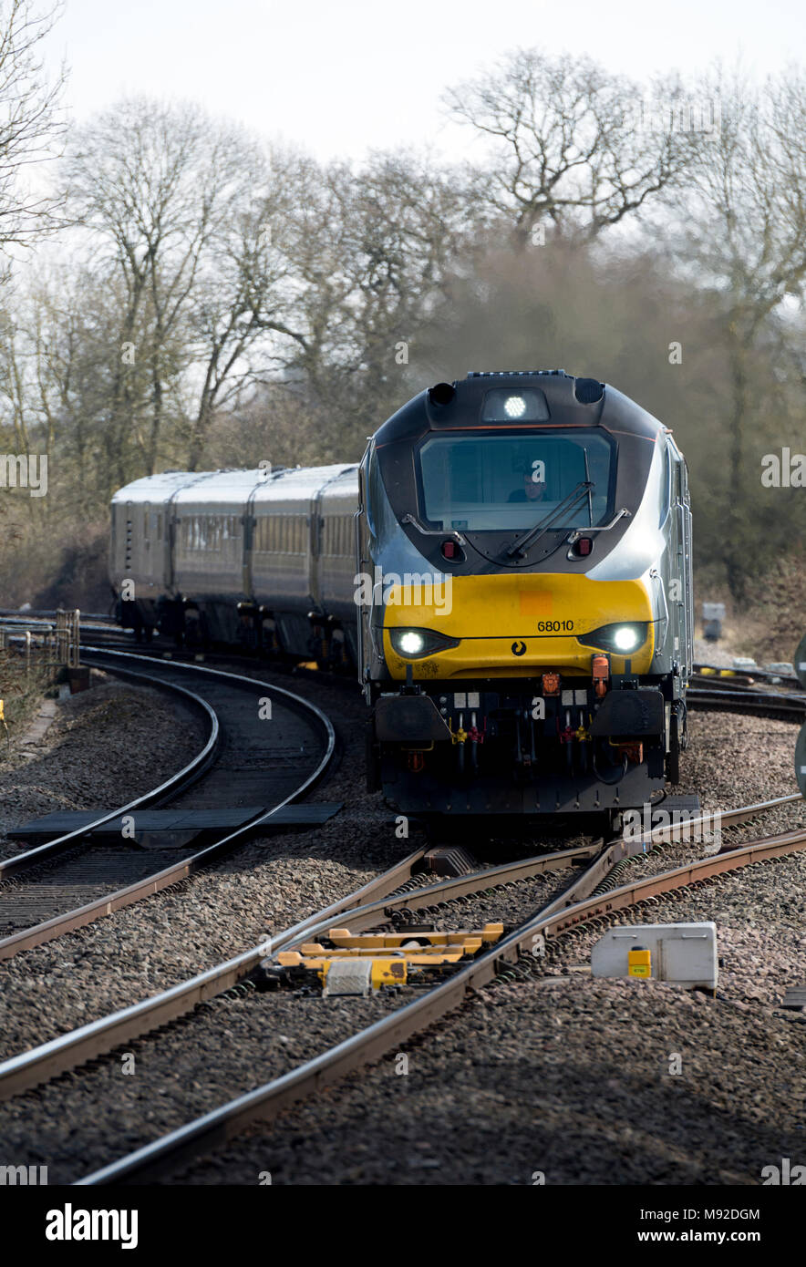 A class 68 diesel locomotive pulling a Chiltern Railways Mainline train at Hatton, Warwickshire, UK Stock Photo