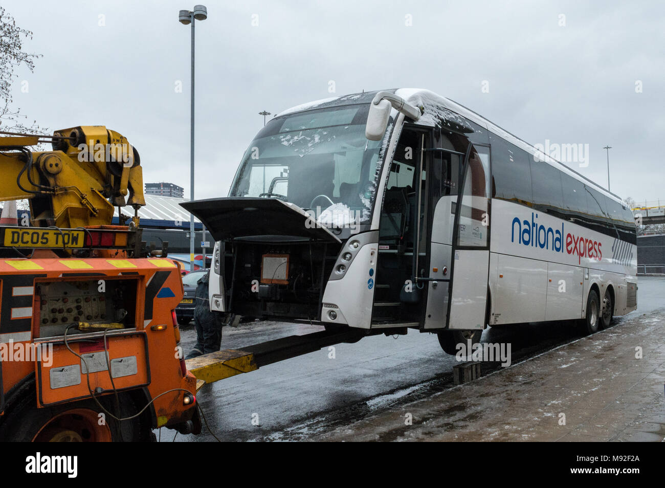 National Express Coach with gear problems being prepared for towing, out of Pool Meadow Bus station in Coventry, UK. Stock Photo