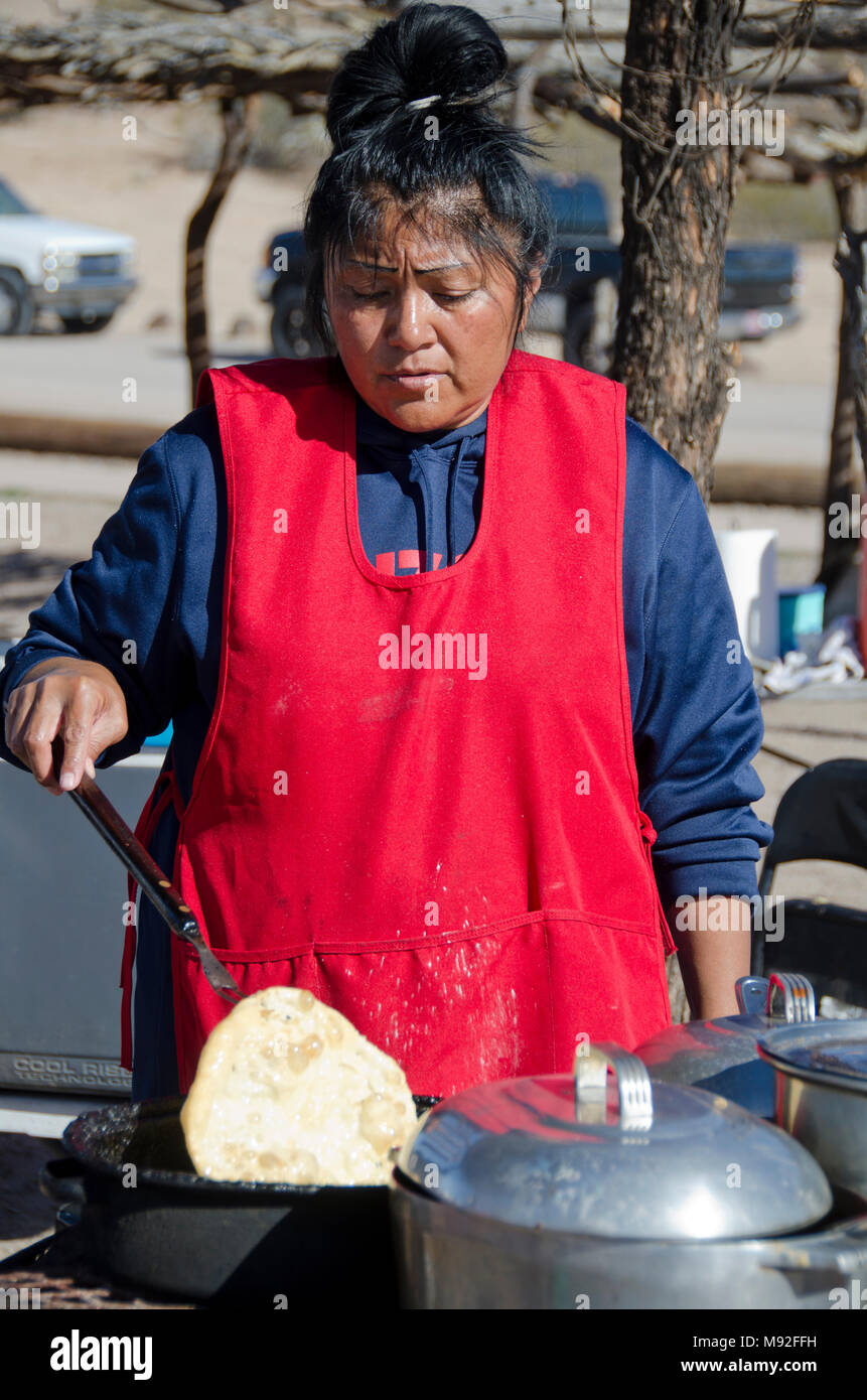 A Tohono O'odham Indian woman makes Indian fry bread for tourists visiting San Xavier del Bac Mission near Tucson, Arizona. Stock Photo