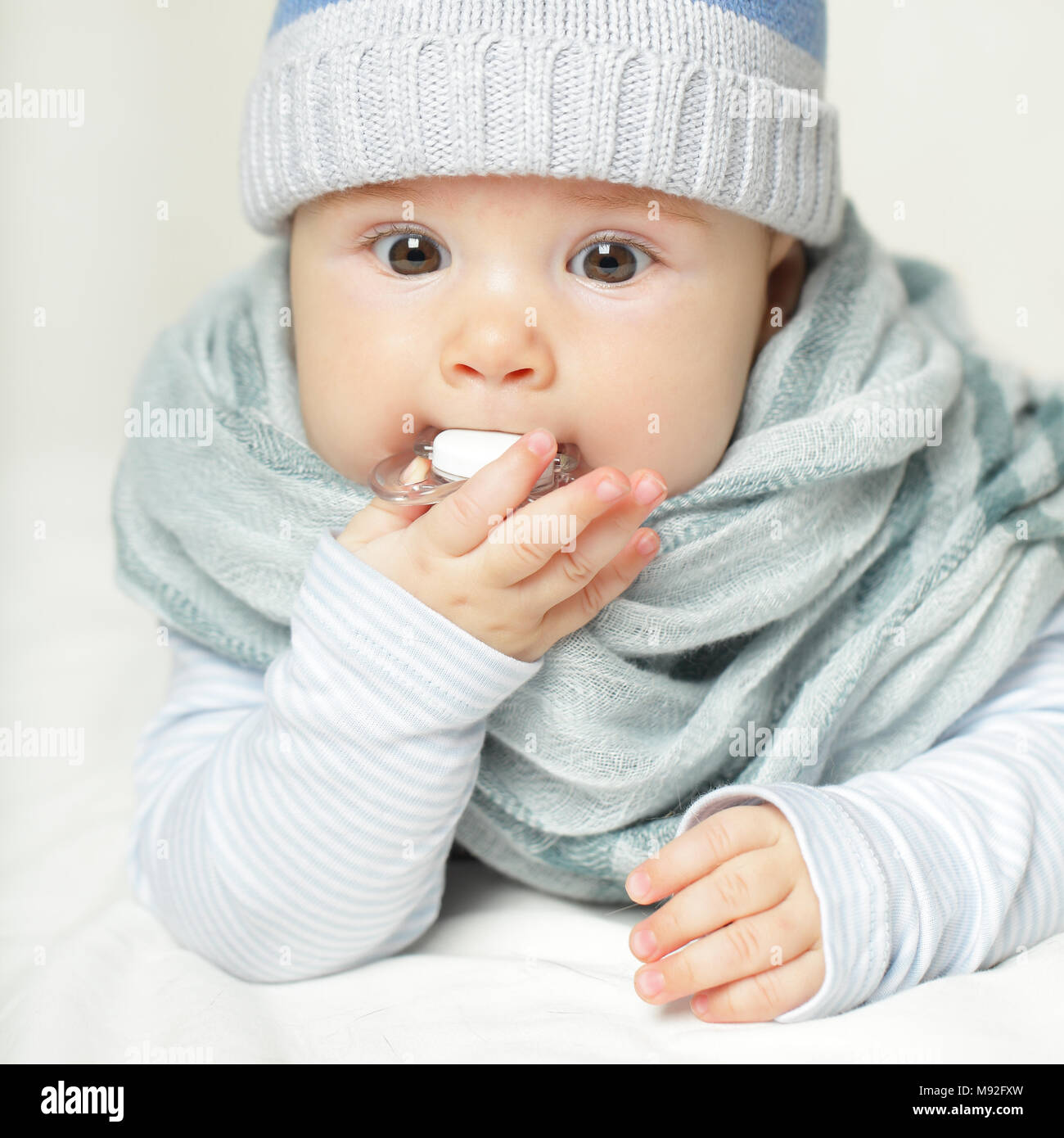 Baby with soother Stock Photo Alamy