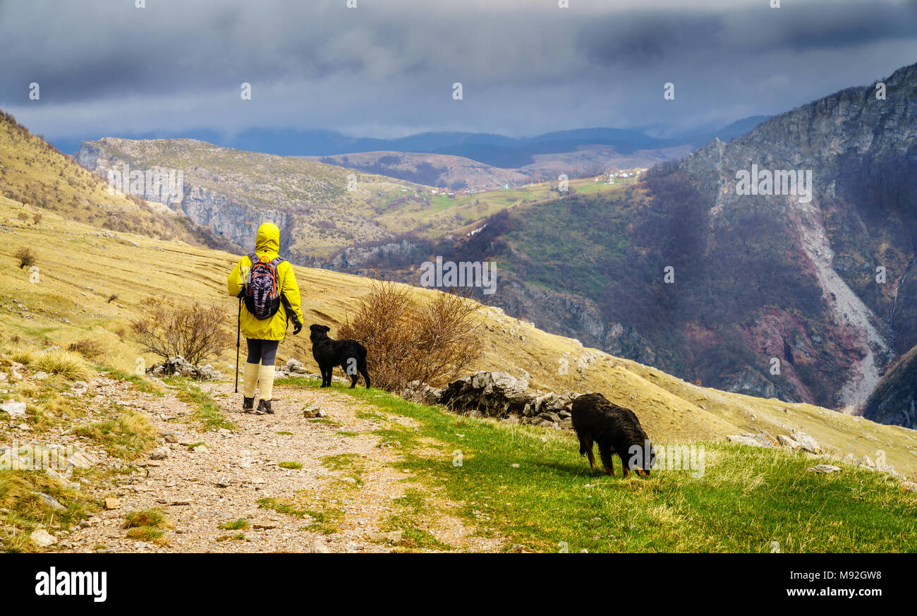 Woman is hiking in Dinaric Alps near Sarajevo, Bosnia-Herzegovina Stock Photo