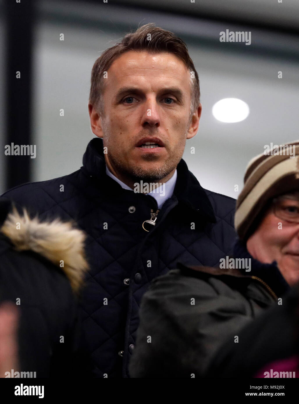 England Women's manager Phil Neville in the stands during the Women's Champions League, Quarter Final at the City Football Academy, Manchester. Stock Photo