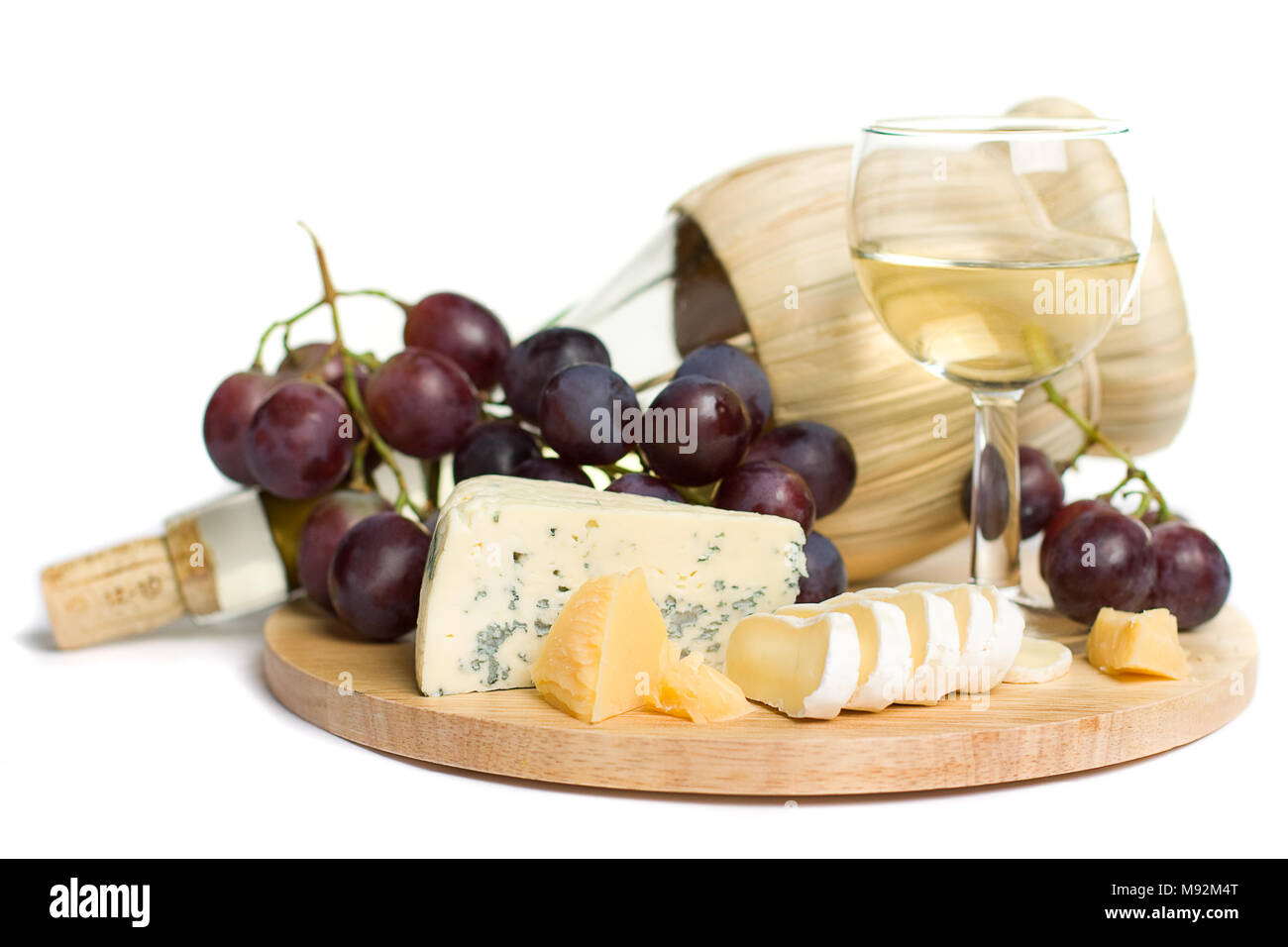 Gourmet food - wine, cheese and grapes isolated (Shallow depth of field) Stock Photo