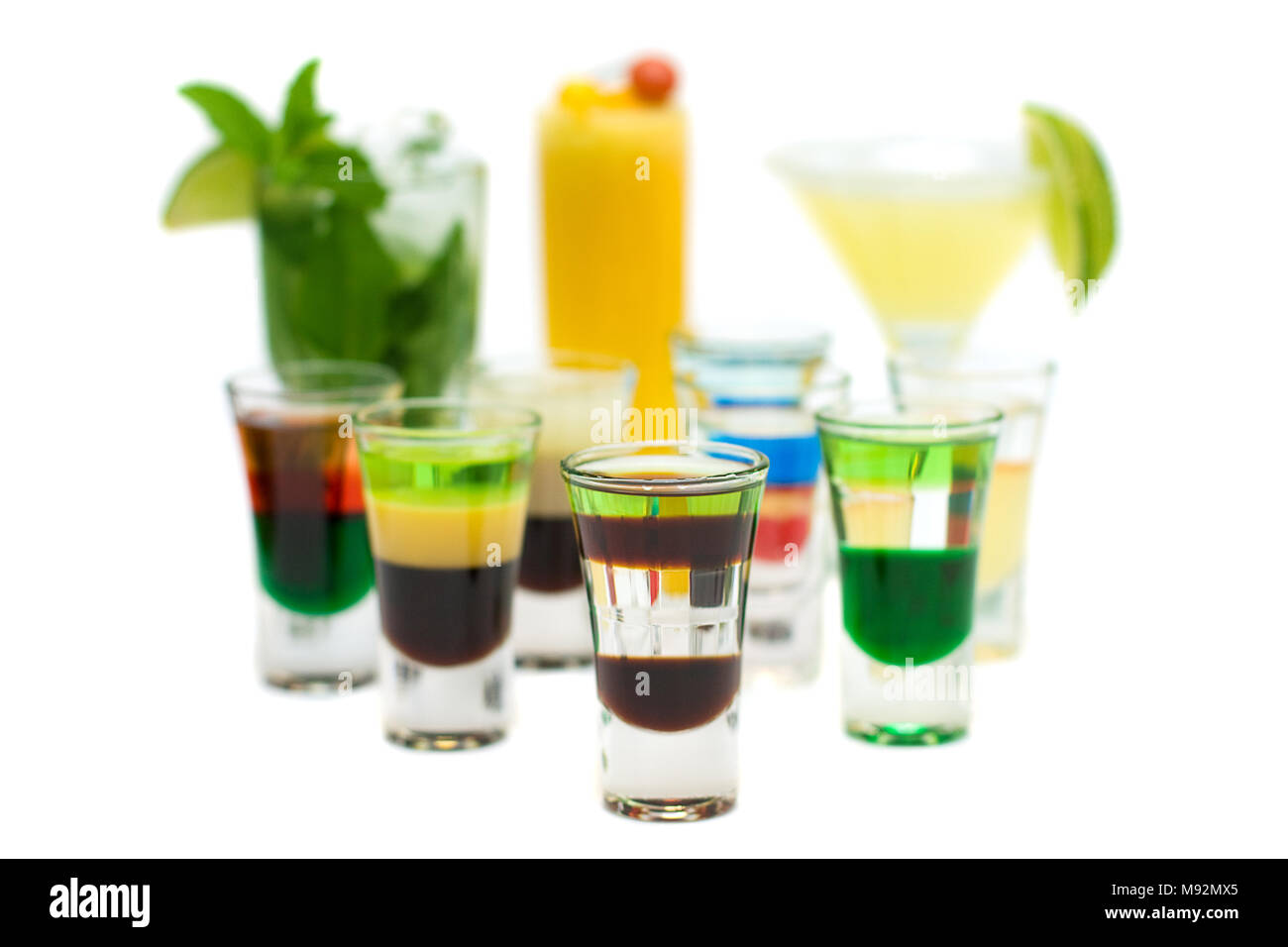 Alcohol Shot Drink on blurred Cocktails - Isolated Stock Photo