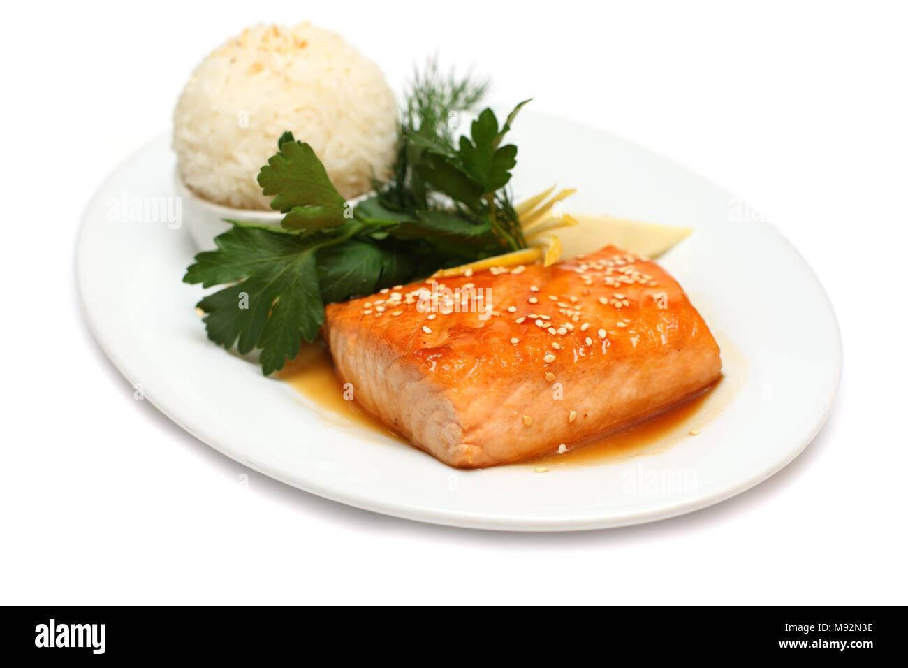 Gourmet food - fish steak on white Stock Photo - Alamy