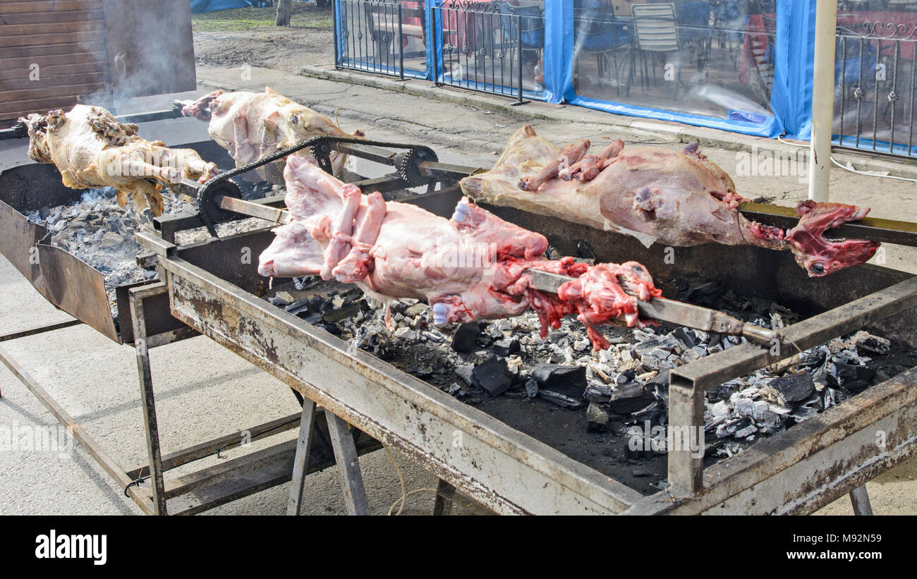 Sheep roasted in Serbia on a spit in a traditional way. Stock Photo