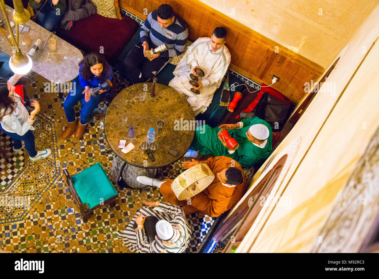 Musicians playing instruments at Cafe Clock in Fes, Morocco Stock Photo