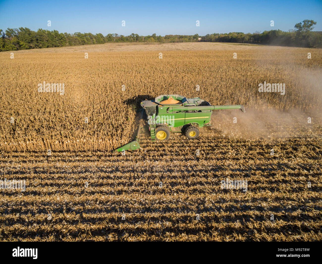 63801-08410 Corn Harvest, John Deere combine harvesting corn - aerial Marion Co. IL Stock Photo