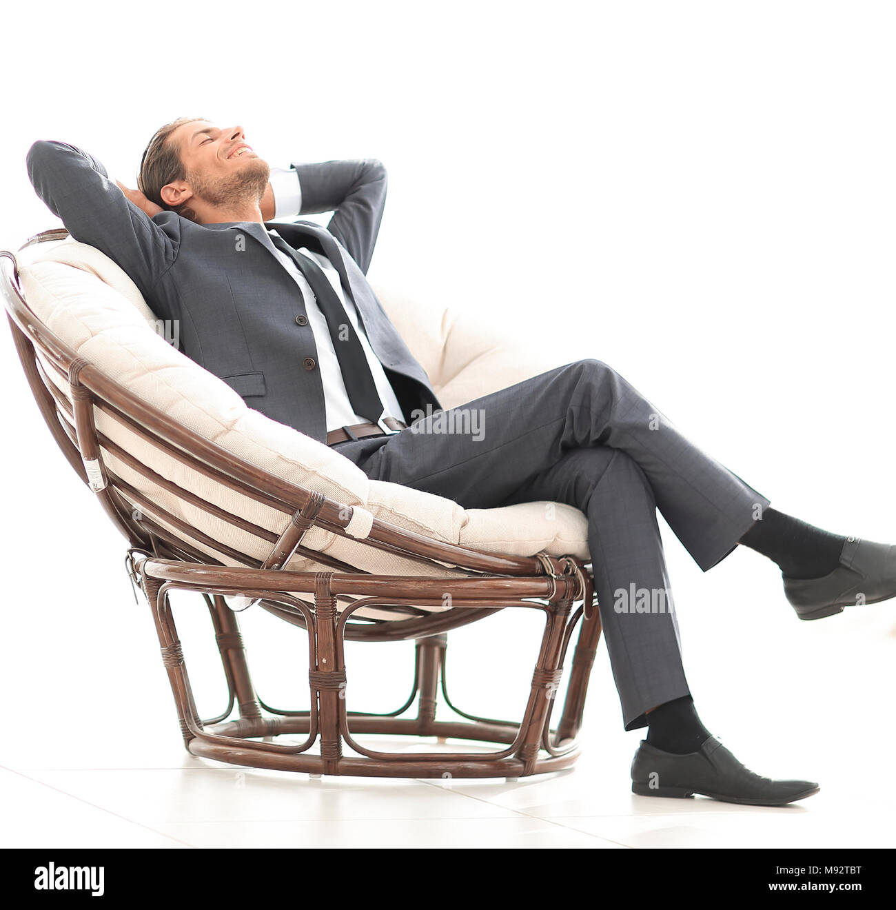 happy businessman relaxing in big comfortable armchair Stock Photo