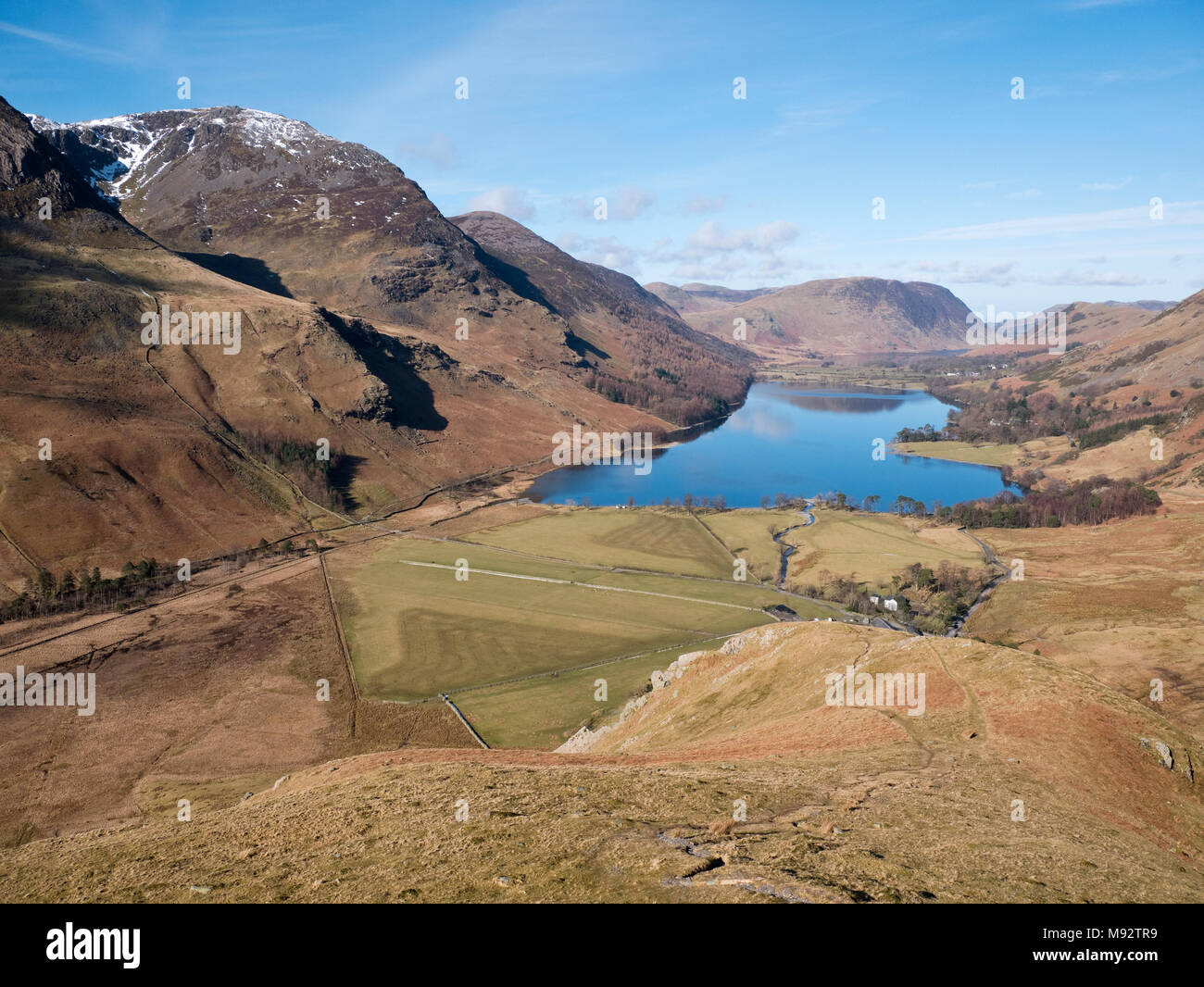 View to Buttermere & Crummock Water from Fleetwith Edge on Fleetwith Pike. The Buttermere Fells rise left while Mellbreak rises over Crummock Water Stock Photo