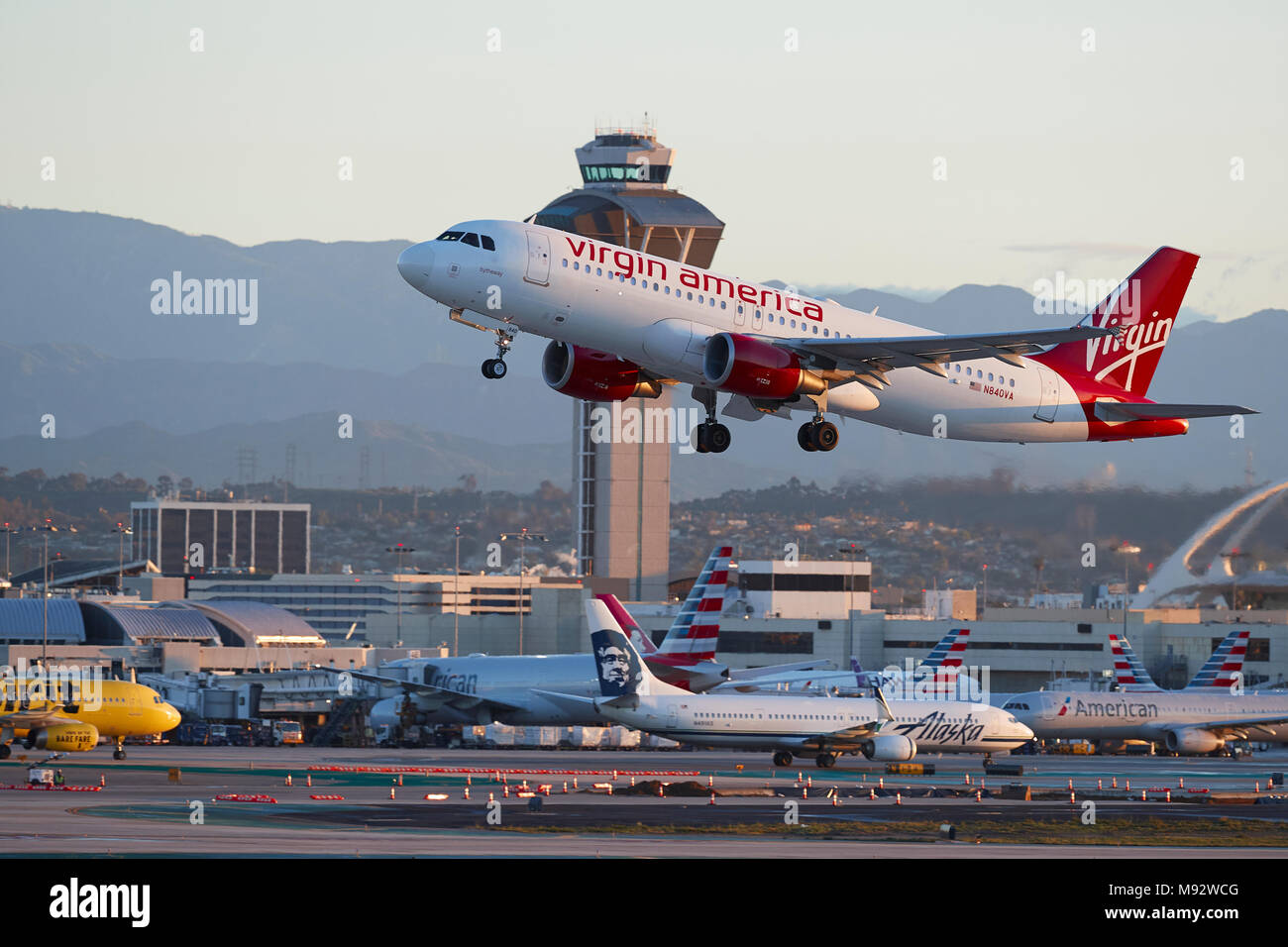 Virgin America Airlines Airbus A320 Taking Off From Los Angeles International Airport, LAX, After Sunrise. The Control Tower In Background. Stock Photo