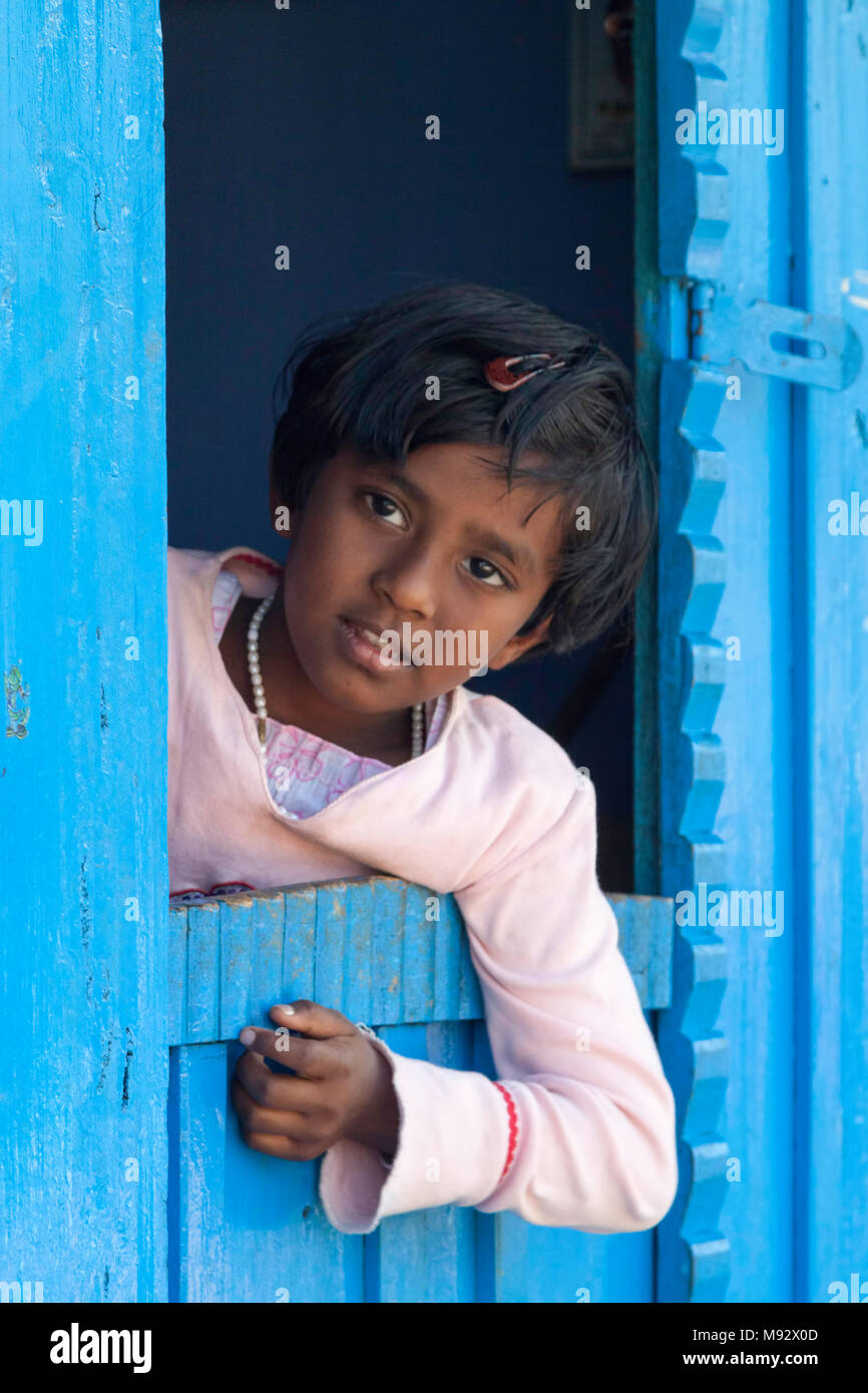 Girl at the blue door, Perikanal tea workers village, Munnar, Kerala, India  Stock Photo - Alamy