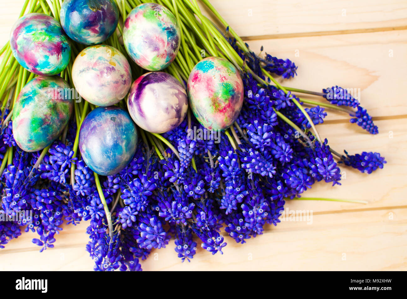 Hand painted Easter eggs and purple spring flowers Stock Photo - Alamy