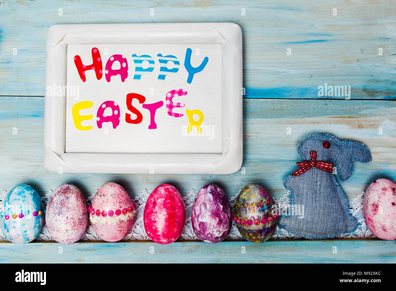 Happy Easter card with creative painted and decorated eggs Stock Photo